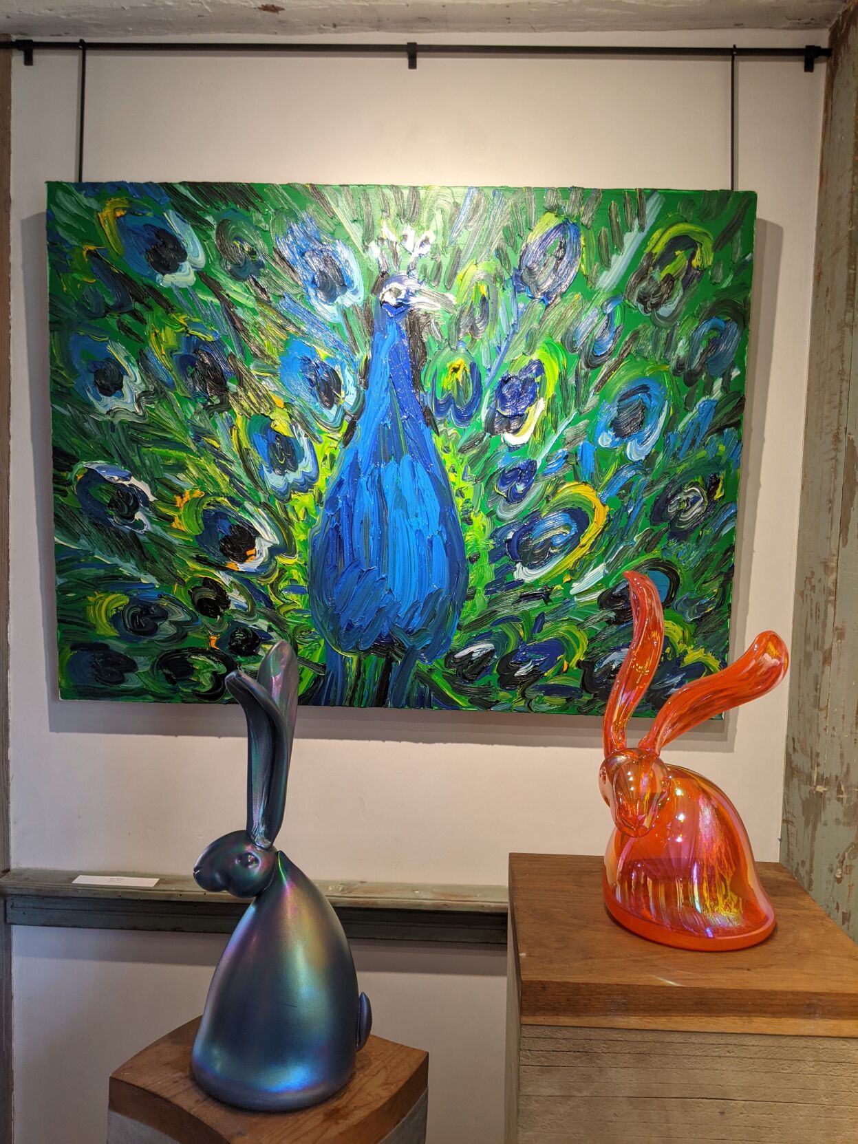 Peacock painting and two rabbits